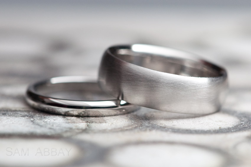 Left: Polished platinum 2.5mm domed wedding ring. Right: Matte finish ...