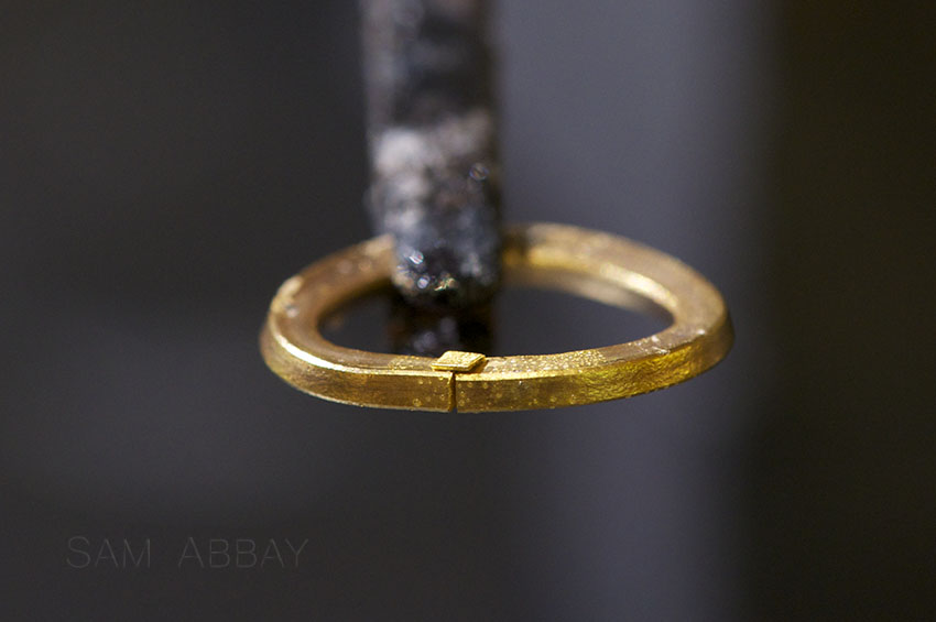 Gold solder chip on ring